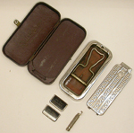 a%20rectangular%20brown%20leather%20case%20with%20a%20Rolls%20razor%20enclosed